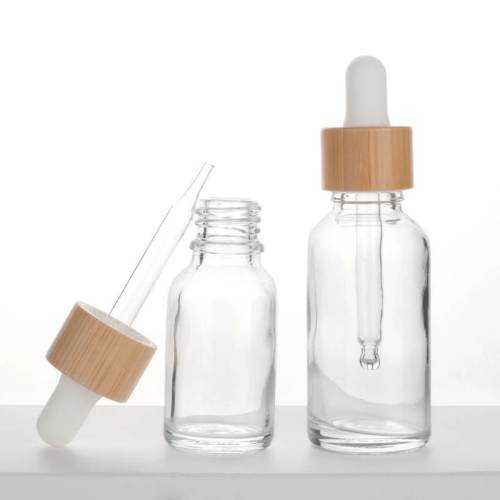 Botellas de aceite esencial con gotero de vidrio transparente europeo al por mayor | cuentagotas de bambú
