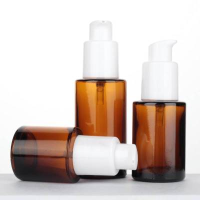 Cylinder Amber Glass Lotion Pump Bottles Wholesale with White Treatment Pump