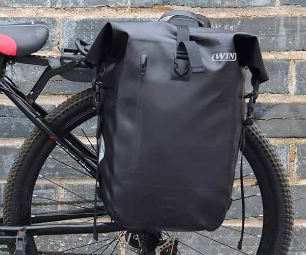 Have you tried putting backpack items on the rear rack of the bike?