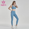 Light blue fitness suit back cross bra with hip lifting pants private label fitness apparel manufacturers