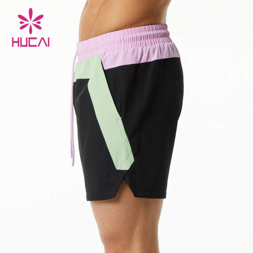 custom workout clothes high quality splicing fashion pocket mens gym shorts supplier