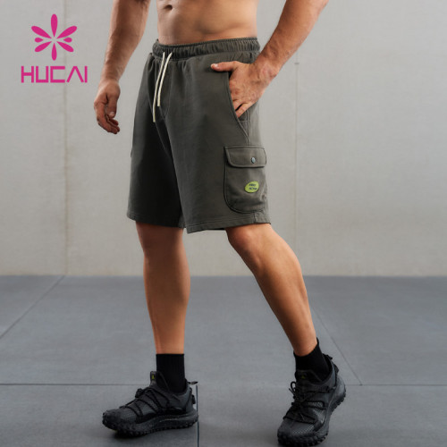 HUCAI Custom Washed Workout Shorts Silicone Logo 3D Pocket Sports Wear Supplier