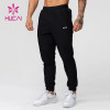 HUCAI Hot Sale Gym Sweatpants Zipper Pockets Screen Printing Drawstring Joggers Supplier