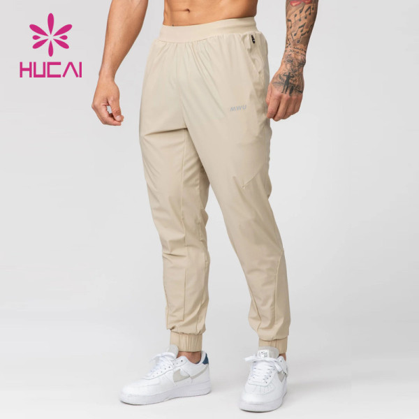 HUCAI Hot Sale Gym Sweatpants Zipper Pockets Screen Printing Drawstring Joggers Supplier