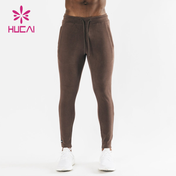 HUCAI Hot Sale Gym Sweatpants Fit With Pockets Silicone Printing Drawstring Joggers Supplier