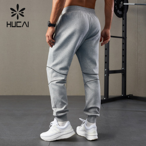 HUCAI OEM Sports Joggers Waterproof Zipper Air-layer Fabric Running Pants Mens