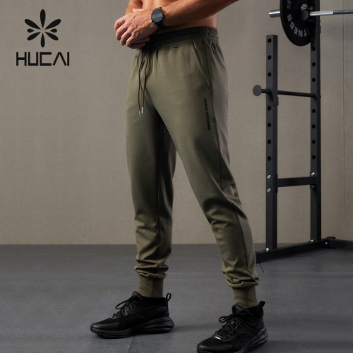 HUCAI OEM Mens Sports Joggers 3D Logo Heat Transfer Sweat Pants Factory China