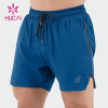 HUCAI OEM Mens Gym Shorts Nylon spandex split Hem zip pocket Custom Activewear Manufacturers