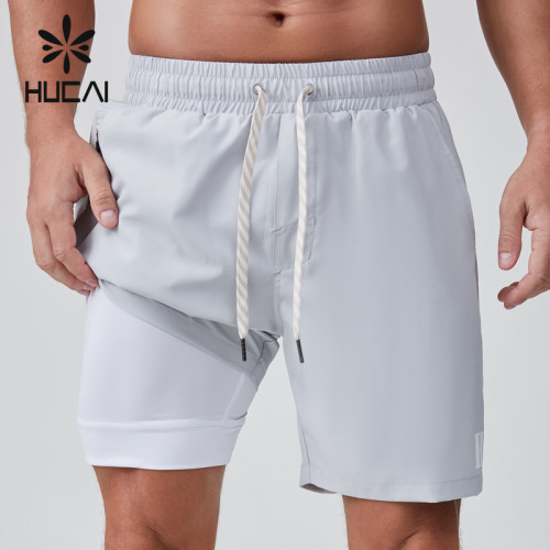 HUCAI OEM Sports Shorts 2 In 1 Zipper Pocket Custom Rivets And Drawstring  Activewear Manufacturer