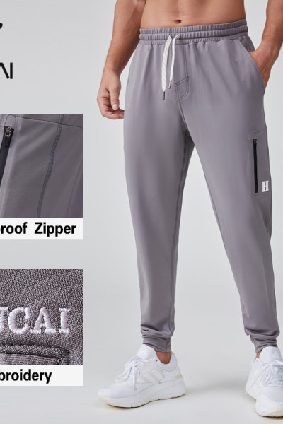 HUCAI OEM Men's Jogger Silicone Logo Embroidery Waterproof Zipper Sports Pants Manufacturer