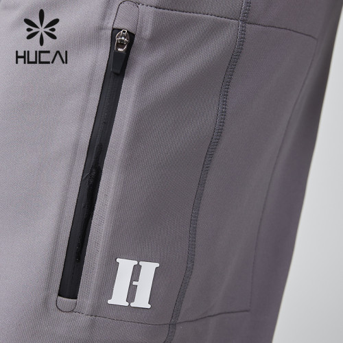 HUCAI OEM Men's Jogger Silicone Logo Embroidery Waterproof Zipper Sports Pants Manufacturer