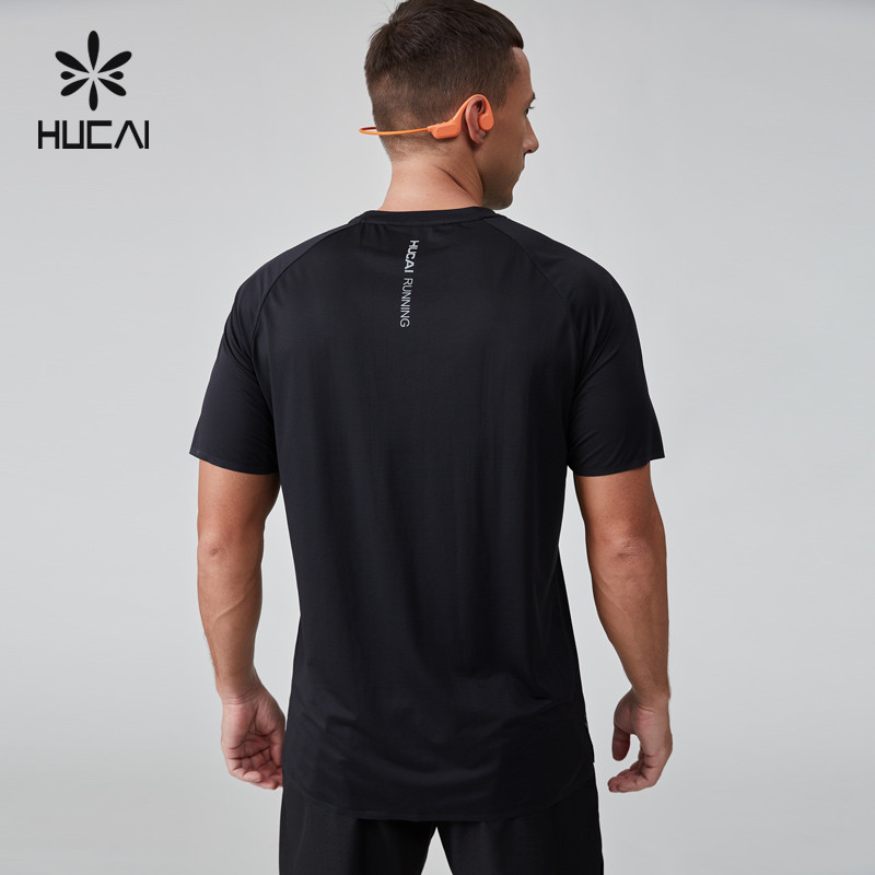 Men's black short sleeve performance running event tee, back view, showing the vertical back print area used for club name and event branding on lightweight moisture wicking knit