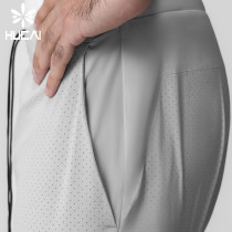 HUCAI Customized Men's Sportswear Laser Punching 2-in-1 Fitness Shorts Manufacturer