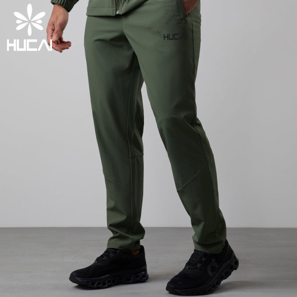 HUCAI Custom Logo Polyester Zipper Pocket Lightweight Fit Men's Sports Training Jogging Pants