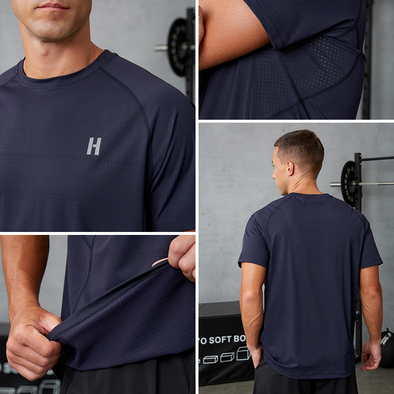 Men's navy raglan performance T-shirt showing underarm laser perforation zone, back panel layout and hem construction detail