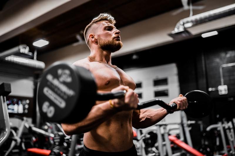 Man performing heavy weight training in gym wear