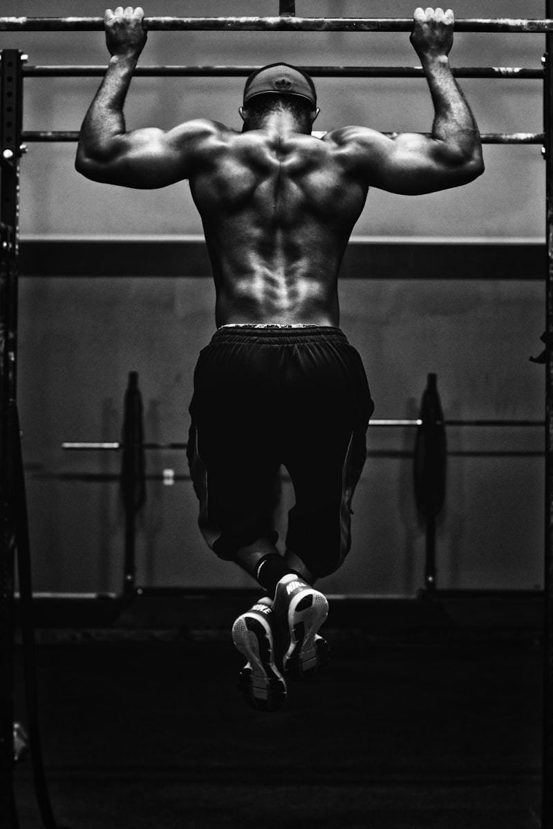 Athlete reviewing a training session, where wear-test feedback on men's activewear samples is collected