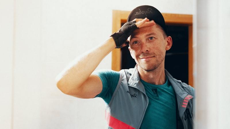 Man feeling the heat during warm weather training, where cooling and thermoregulation fabric claims are evaluated