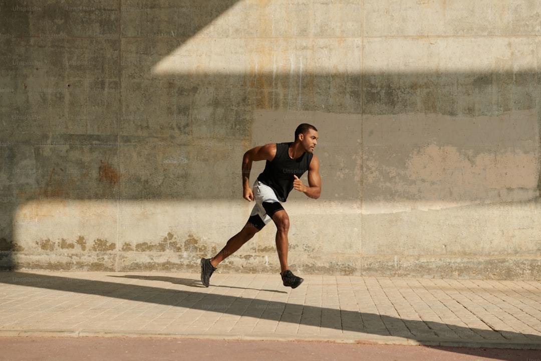 Runner pushing hard in warm outdoor conditions, where heat-zone ventilation determines how a men's running top feels