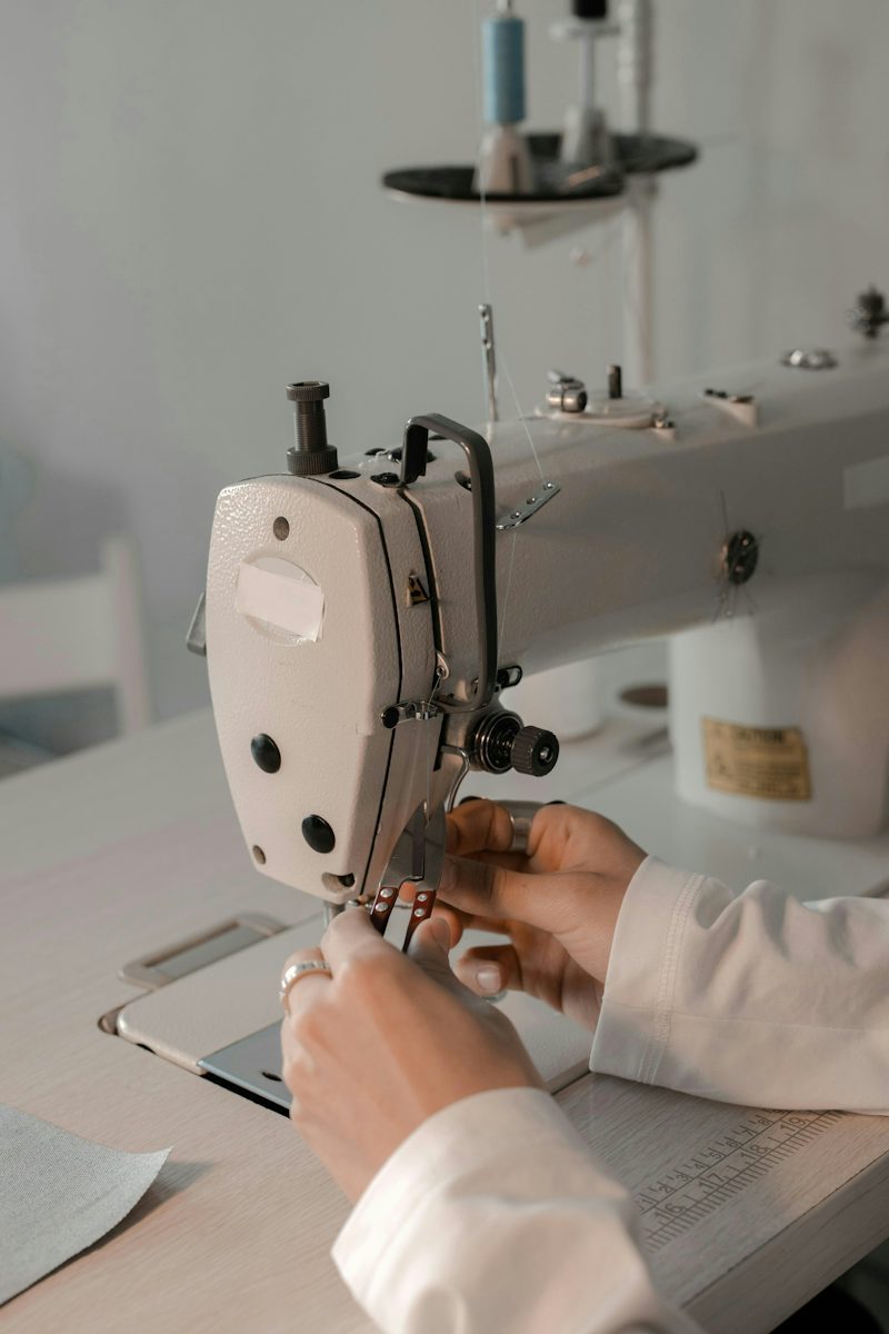 sewing machine and hands at work