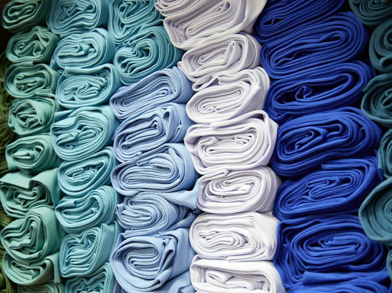 stacked folded fabric in a workshop
