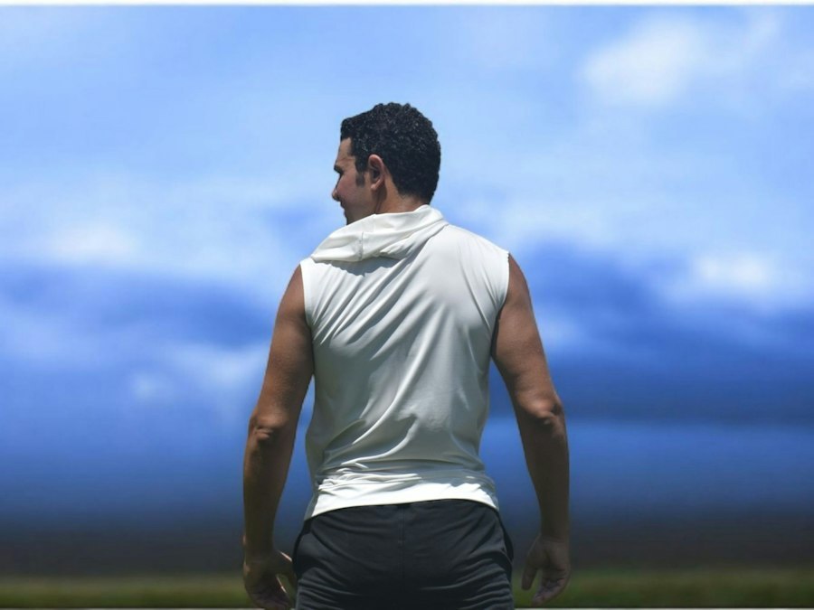 Sleeveless performance top shown from behind, highlighting the armhole and back panel