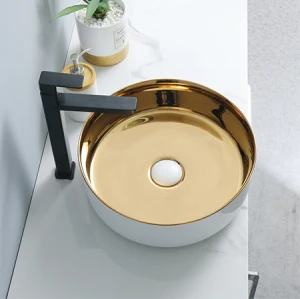 Lujoso lavabo de cerámica con encimera de color dorado de forma redonda al por mayor