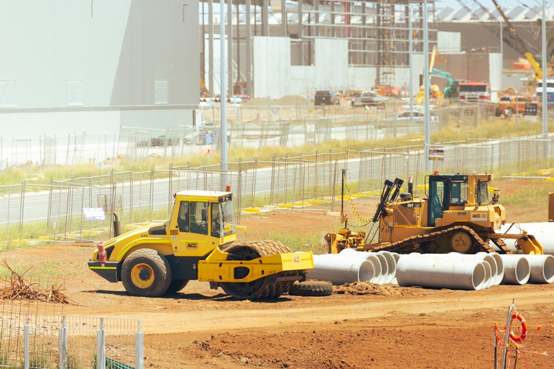 An HDPE pipe fusion machine joining two pipes on a construction site