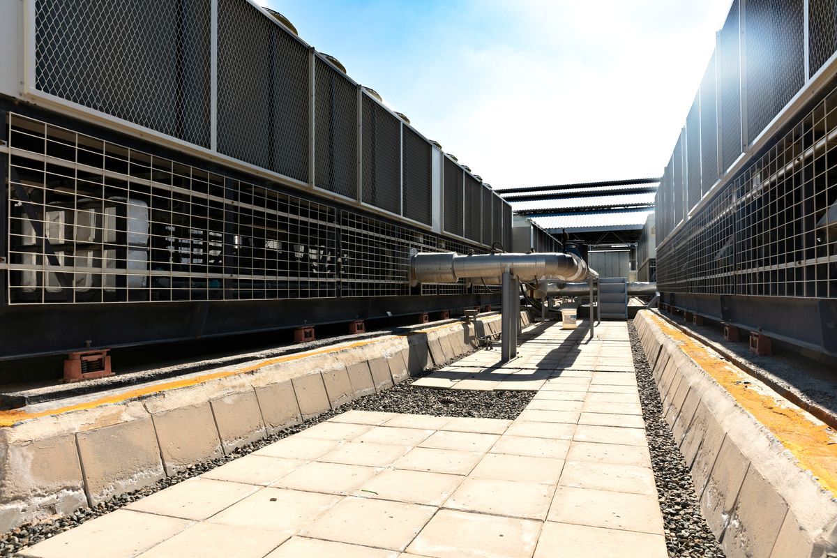 Industrial cooling and dehumidification equipment installed outdoors at a manufacturing facility