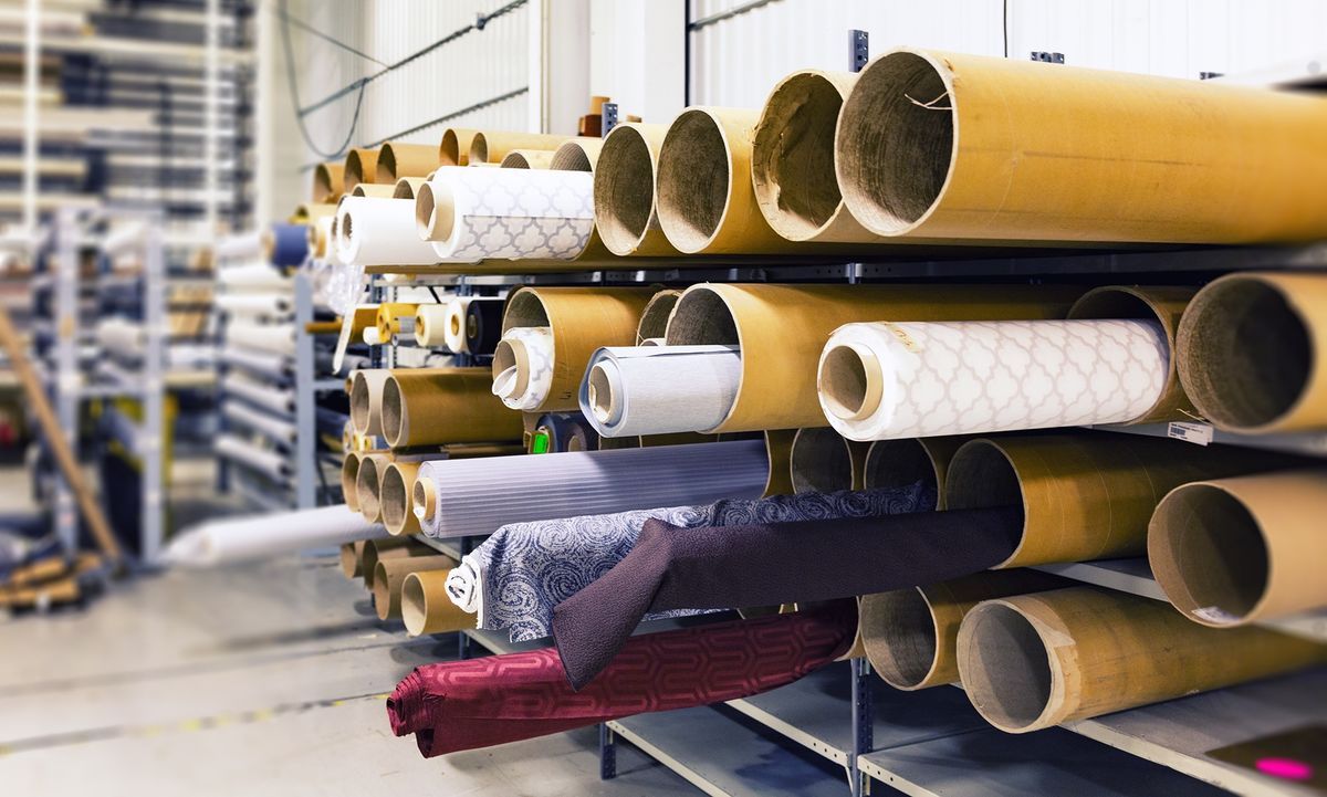 Rolled textile fabric lot stored in a material preparation area