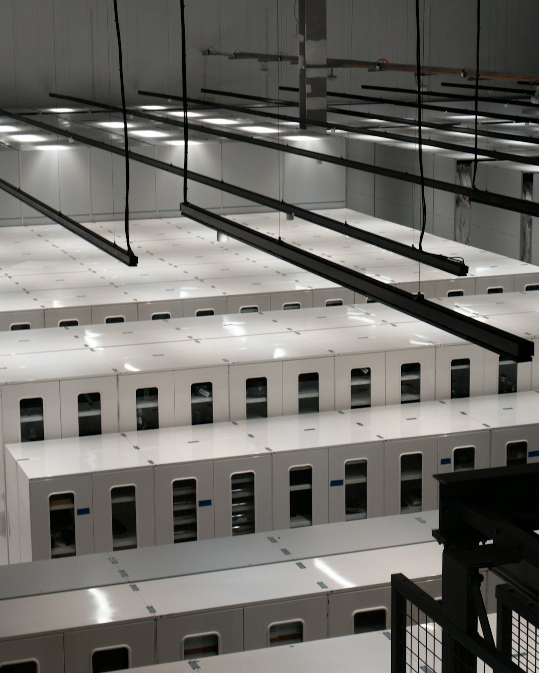 Rows of server cabinets in a modern data center