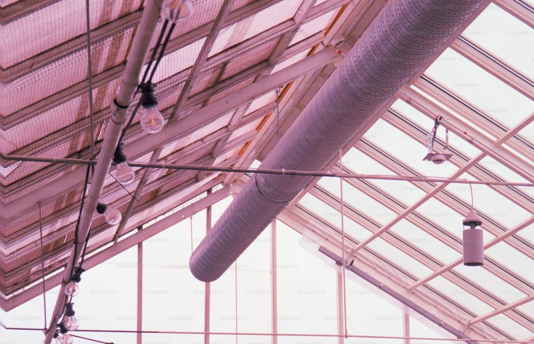 Ceiling mounted dehumidifier for greenhouse ventilation