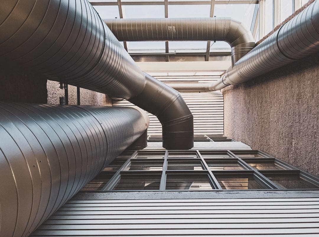 Split heating cooling dehumidifier piping system