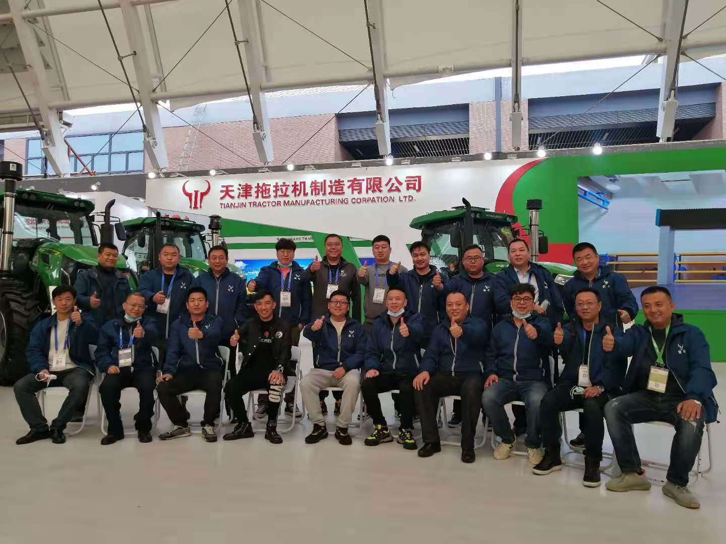 Employees of TieNiu company attend agricultural tractor exhibition in Qingdao, China