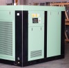 How does a screw compressor compress the gas?