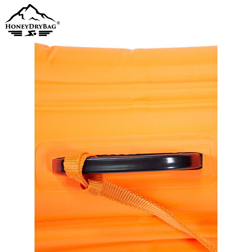 A firm handle that carries the buoy and attaches the strap.