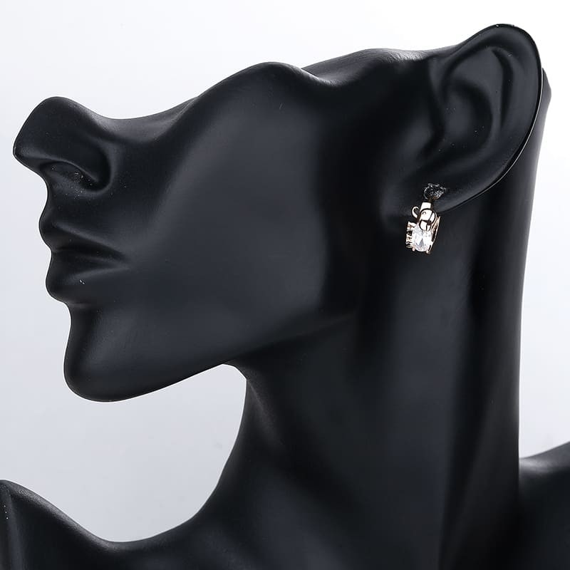 white turtle huggie earring wearing