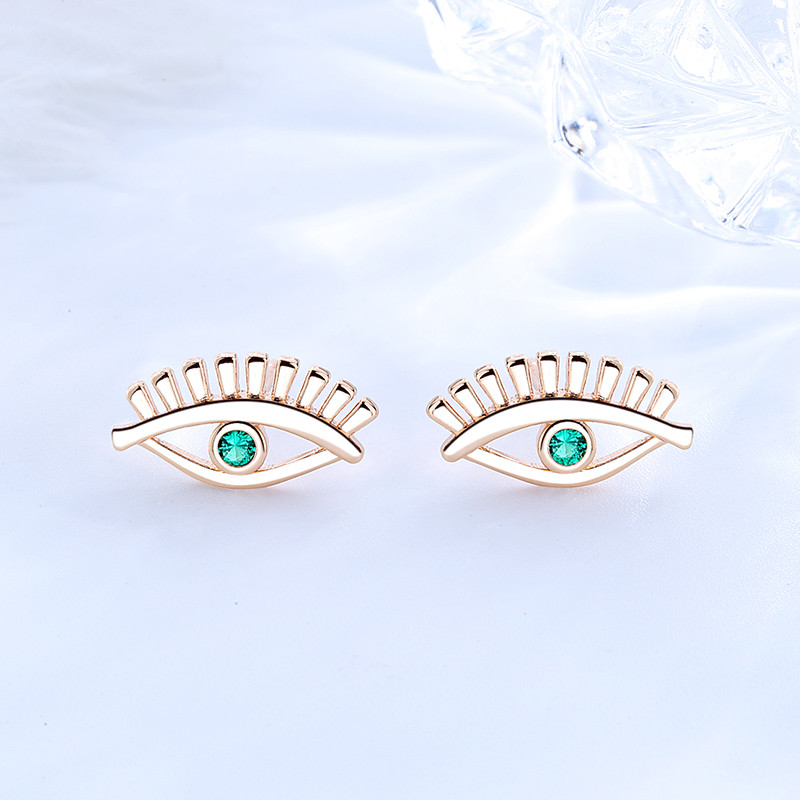 green eye ear stud