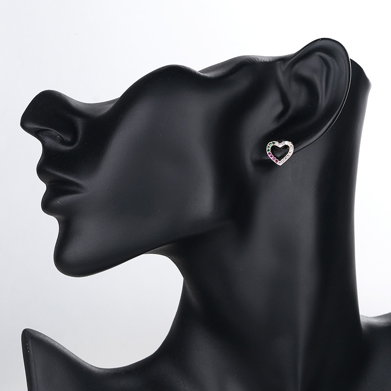 wearing multicolor heart stud earring