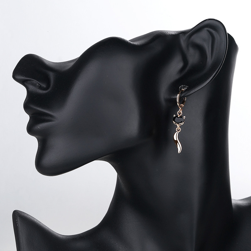 wearing black fox drop earring