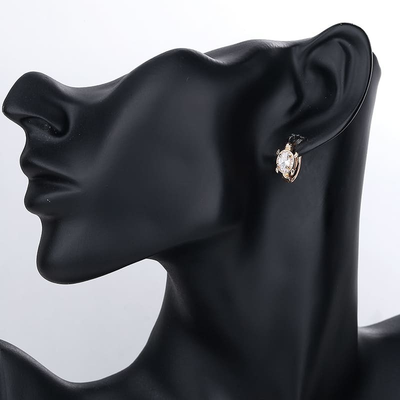 white turtle huggie earring wearing