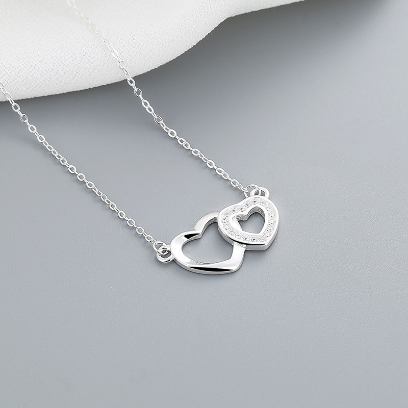 Discover the Timeless Symbolism of the Double Heart Zircon Silver Necklace