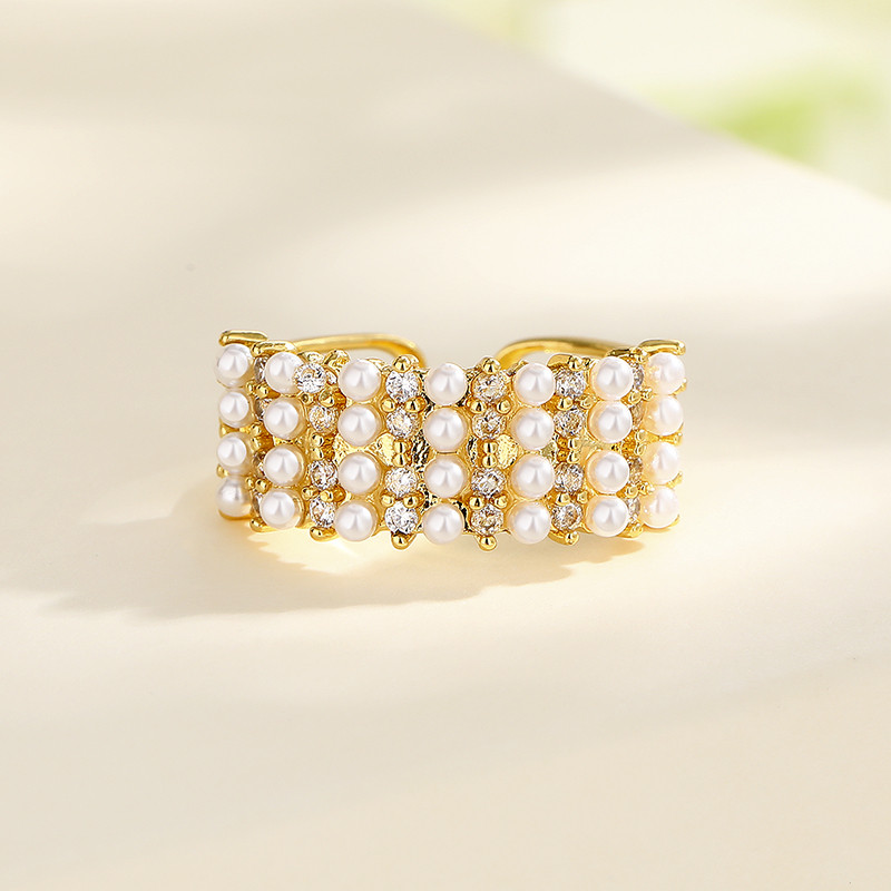 descubre la serie de anillos chapados en oro con circonitas y perlas