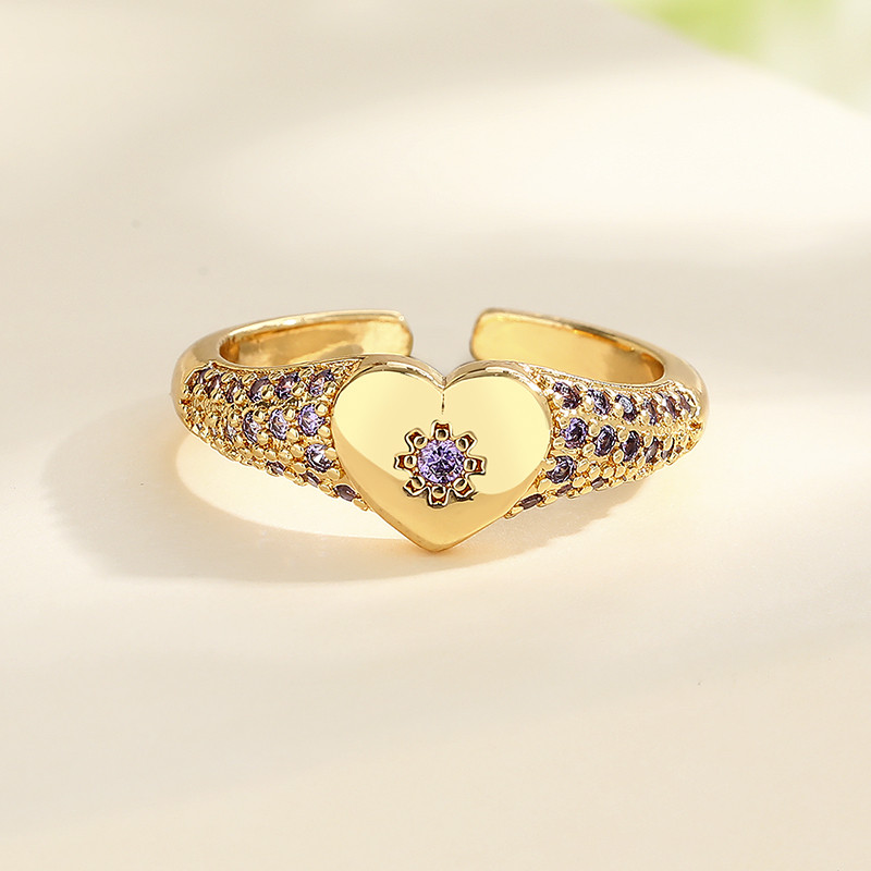 anillos chapados en oro con circonitas y flores en forma de corazón