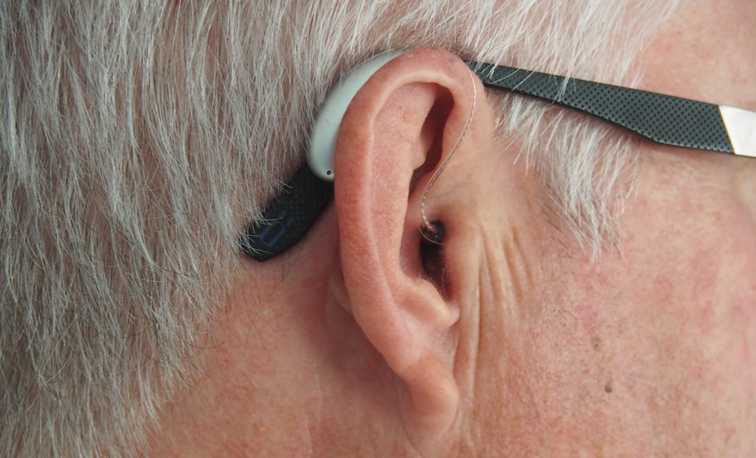 A curated ear stack with multiple huggie earrings and studs