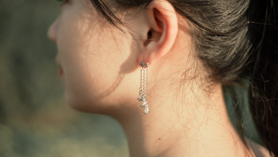 Close-up of diamond pavé huggie earrings