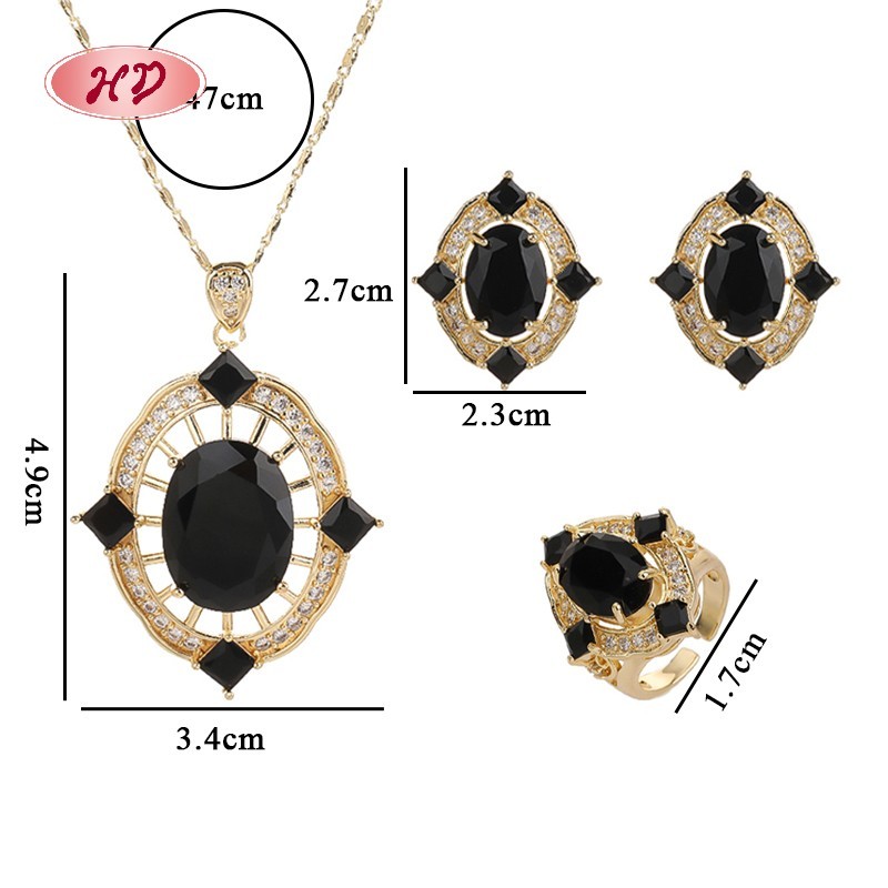 Conjunto de anillo, collar y aretes con gemas rojas en oro de 18 quilates
