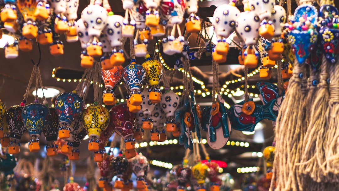 A vibrant collection of animal and fruit themed jewelry pieces displayed on a mannequin