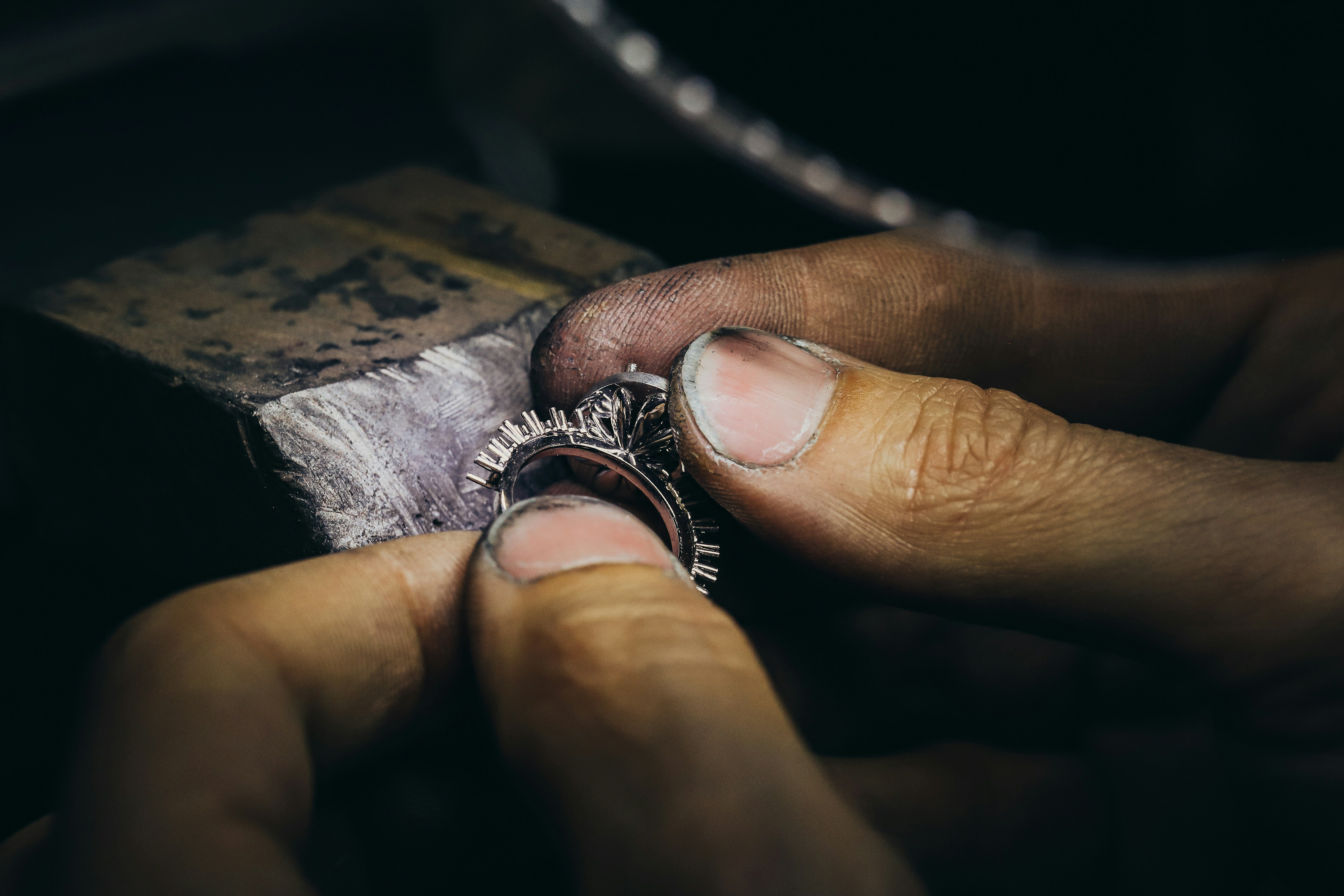 A collage of images showing detailed craftsmanship in jewelry: one showing secure prongs on a ring, another showing a smooth polished finish on a bracelet, and a third showing an intricate, unique design.