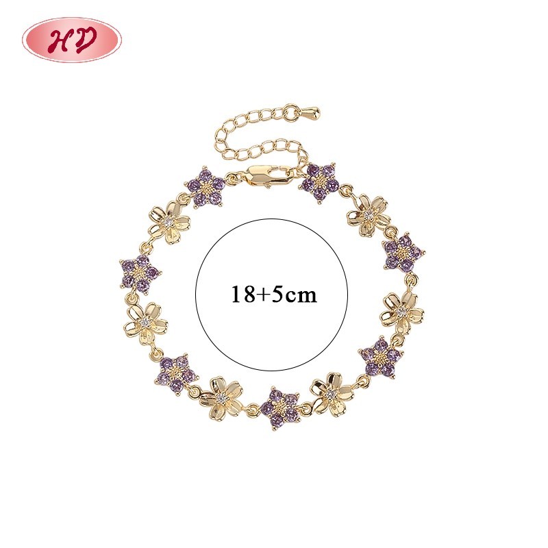 Purple cubic zirconia flower link tennis bracelet in 18K gold plating